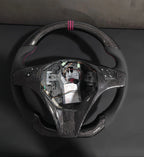 Romeo and Juliet carbon fiber steering wheel paired with purple return-to-center emblem, wrapped in perforated black leather